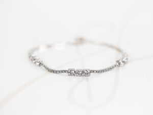 PULSERA PLATA RODIZADA TRIPLE CUADRO TOPACIO BLANCO